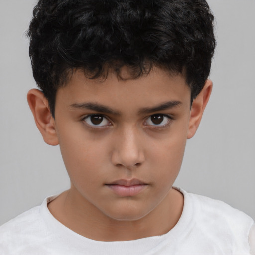 Neutral latino child male with short  brown hair and brown eyes
