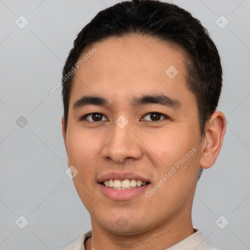 Joyful white young-adult male with short  black hair and brown eyes