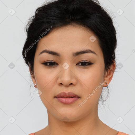 Joyful asian young-adult female with medium  black hair and brown eyes