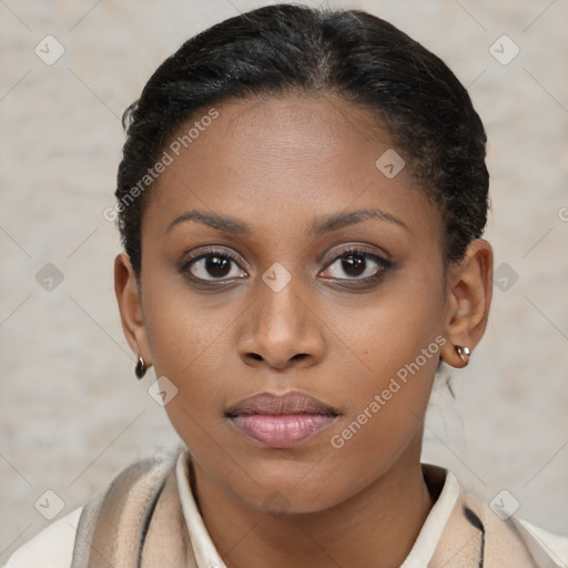 Joyful black young-adult female with short  brown hair and brown eyes