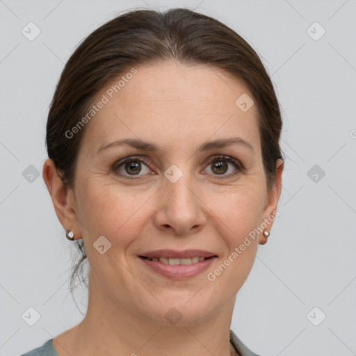 Joyful white adult female with short  brown hair and grey eyes