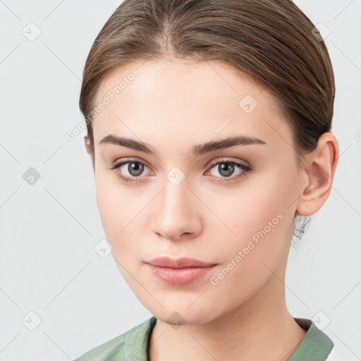 Neutral white young-adult female with medium  brown hair and brown eyes