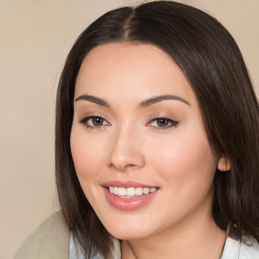 Joyful white young-adult female with medium  brown hair and brown eyes