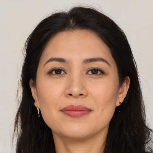 Joyful asian young-adult female with long  brown hair and brown eyes