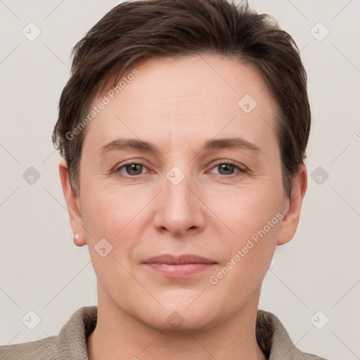 Joyful white young-adult female with short  brown hair and grey eyes