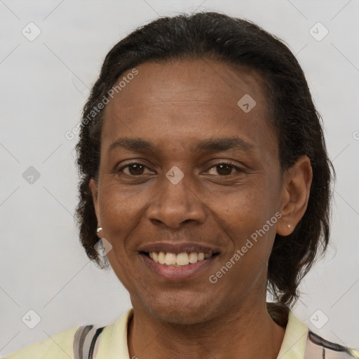 Joyful latino adult female with short  brown hair and brown eyes