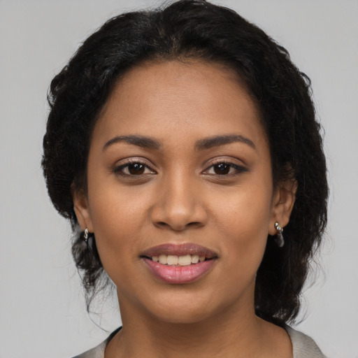 Joyful latino young-adult female with medium  black hair and brown eyes