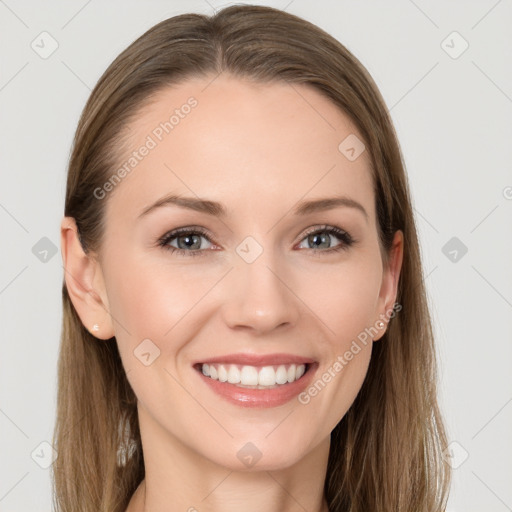 Joyful white young-adult female with long  brown hair and grey eyes