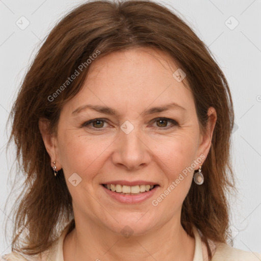 Joyful white adult female with medium  brown hair and grey eyes