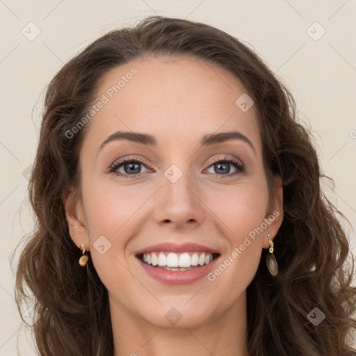 Joyful white young-adult female with long  brown hair and green eyes