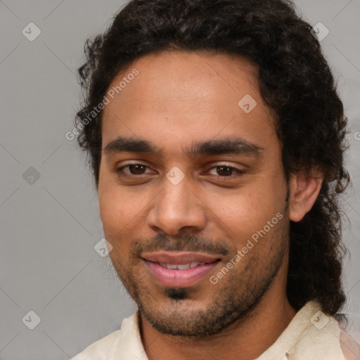 Joyful black young-adult male with short  brown hair and brown eyes