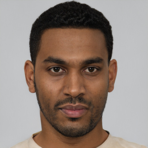 Neutral black young-adult male with short  black hair and brown eyes