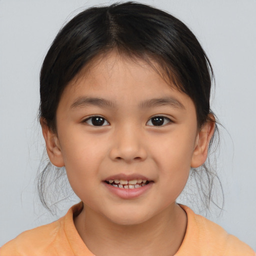Joyful asian child female with medium  brown hair and brown eyes