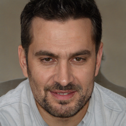 Joyful white adult male with short  brown hair and brown eyes