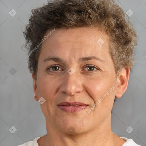 Joyful white adult female with short  brown hair and brown eyes