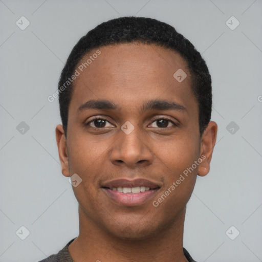 Joyful black young-adult male with short  black hair and brown eyes