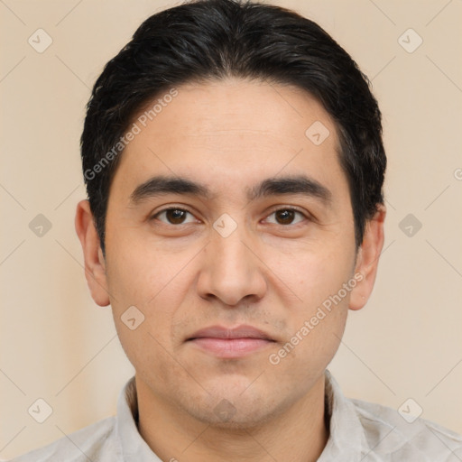 Joyful white young-adult male with short  black hair and brown eyes