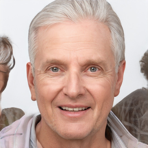 Joyful white middle-aged male with medium  blond hair and brown eyes