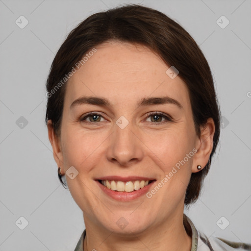 Joyful white adult female with medium  brown hair and grey eyes