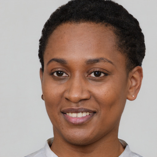Joyful latino young-adult female with short  black hair and brown eyes