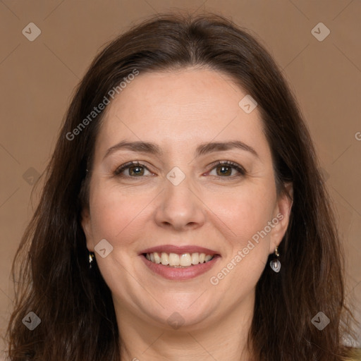 Joyful white adult female with long  brown hair and brown eyes