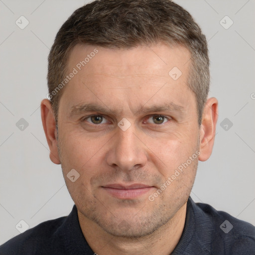 Joyful white adult male with short  brown hair and brown eyes