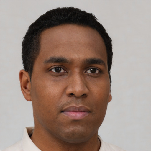 Neutral black young-adult male with short  brown hair and brown eyes
