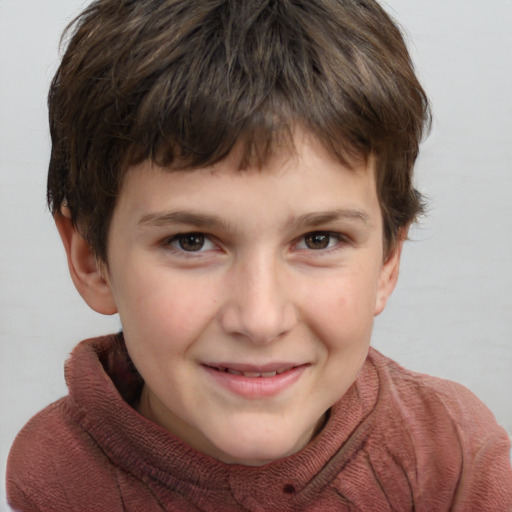 Joyful white child male with short  brown hair and brown eyes