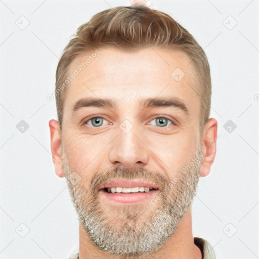 Joyful white young-adult male with short  brown hair and grey eyes