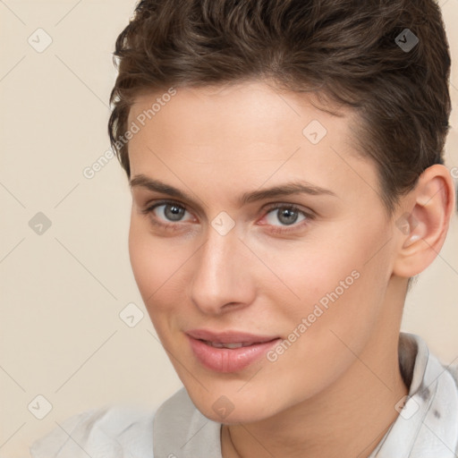 Joyful white young-adult female with short  brown hair and brown eyes