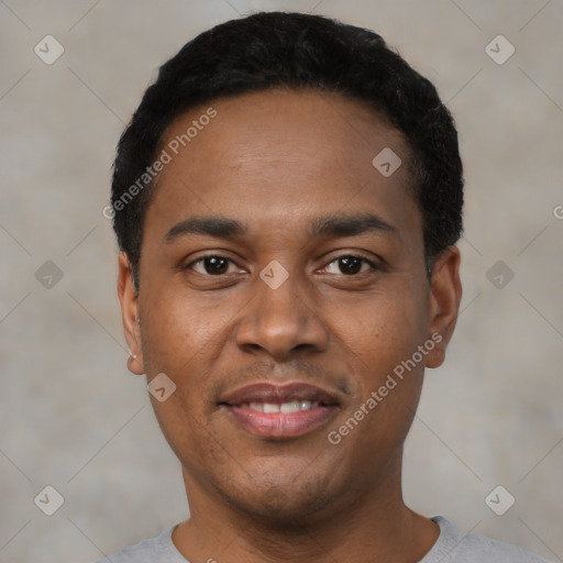 Joyful black young-adult male with short  black hair and brown eyes