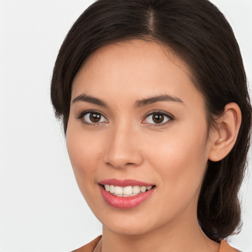 Joyful white young-adult female with medium  brown hair and brown eyes