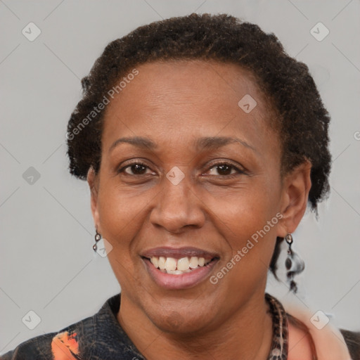 Joyful latino adult female with short  brown hair and brown eyes