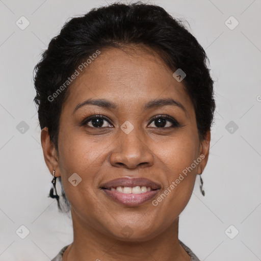 Joyful black adult female with short  brown hair and brown eyes