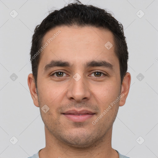 Joyful white young-adult male with short  brown hair and brown eyes