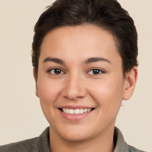 Joyful white young-adult female with short  brown hair and brown eyes