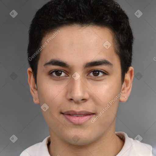 Joyful latino young-adult male with short  brown hair and brown eyes