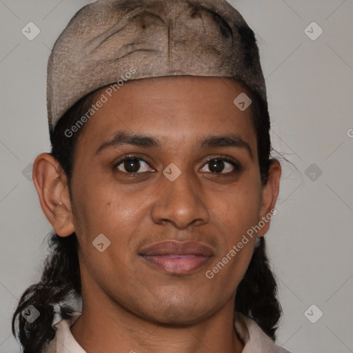 Joyful latino young-adult male with short  brown hair and brown eyes