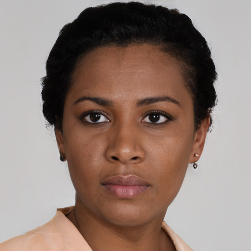 Neutral black young-adult female with short  black hair and brown eyes