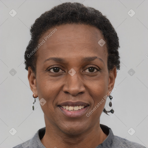 Joyful black adult female with short  brown hair and brown eyes