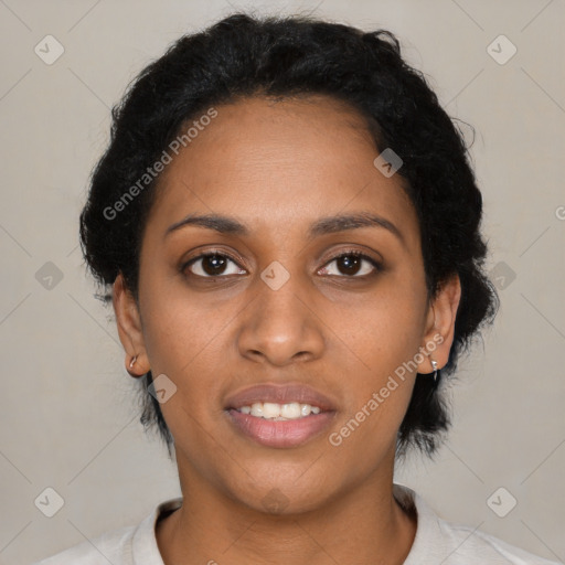 Joyful black young-adult female with short  black hair and brown eyes