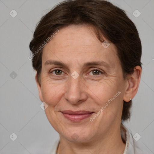 Joyful white adult female with short  brown hair and brown eyes