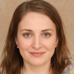 Joyful white young-adult female with long  brown hair and green eyes