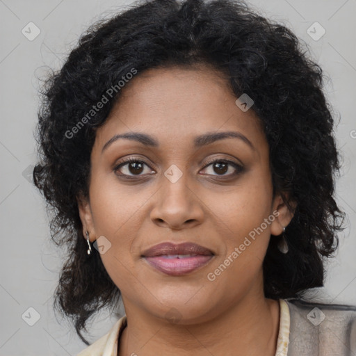 Joyful black young-adult female with long  brown hair and brown eyes