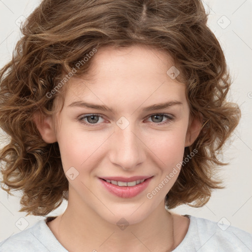 Joyful white child female with medium  brown hair and brown eyes