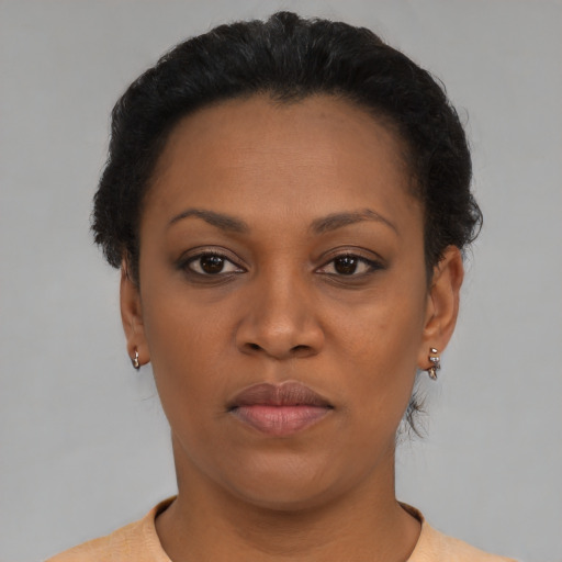 Neutral latino young-adult female with short  black hair and brown eyes