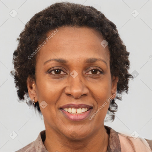 Joyful black adult female with short  brown hair and brown eyes