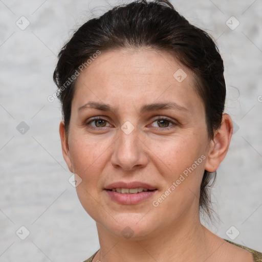 Joyful white adult female with short  brown hair and grey eyes