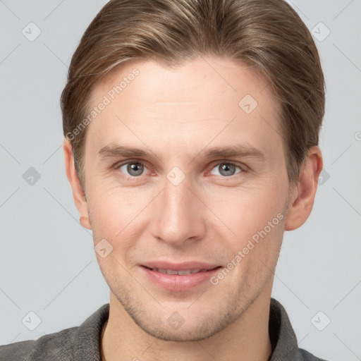 Joyful white young-adult male with short  brown hair and grey eyes