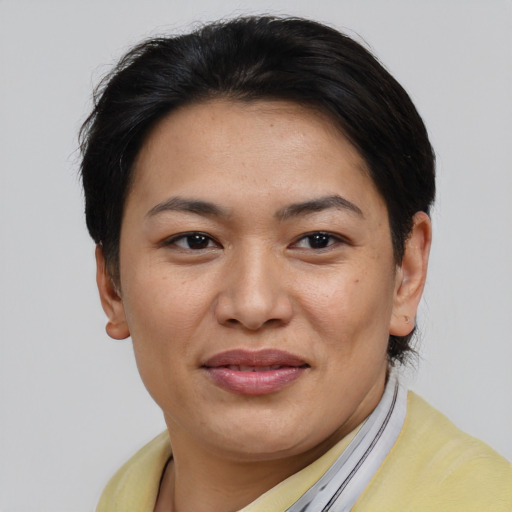 Joyful asian young-adult female with short  brown hair and brown eyes